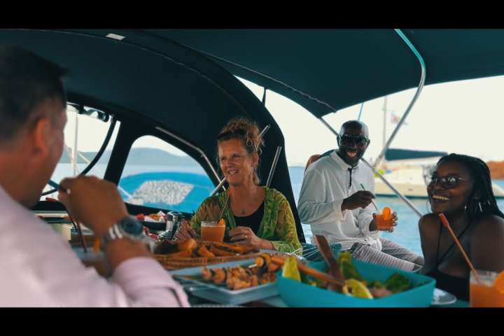 a group of people sitting and looking at the camera